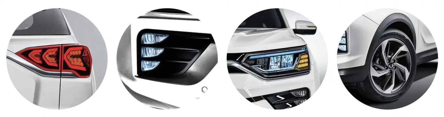 Detailaufnahmen der Rückleuchte, Nebelscheinwerfer, Frontscheinwerfer und Felge des KGM Korando in Weiß.